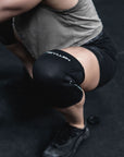 Reyllen Venta X2 5mm Knee Sleeves Neoprene black support shown while in squat