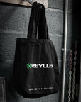 reyllen canvas cotton tote bag black hanging on rail