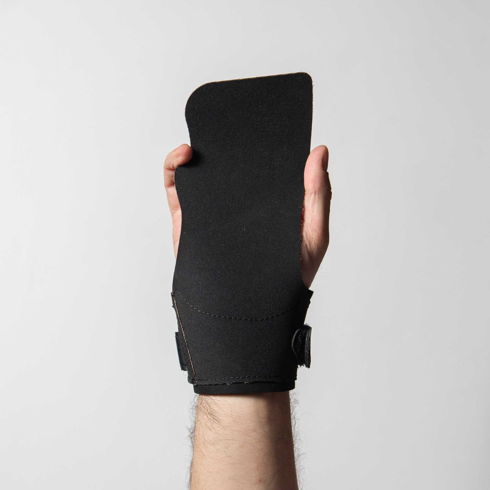 Reyllen Seal Pro Rubber Gymnastic Hand Grips no chalk for crossfit black on white background worn on hand