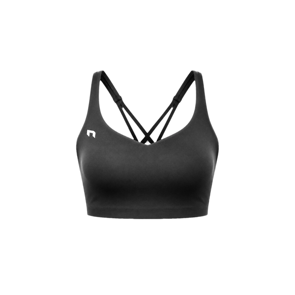Reyllen Women's Echo Sport Bra in black, laid flat front on, showing the strappy cross back straps