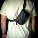 reyllen x-pac tech case pouch sling bag worn on back