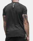 Reyllen m1 t-shirt. Polyester raglan style charcoal black mens modelled by man back view