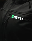 Reyllen Soft Shell Jacket Unisex Polyester Fleece Hood  worn by woman front logo detail shot