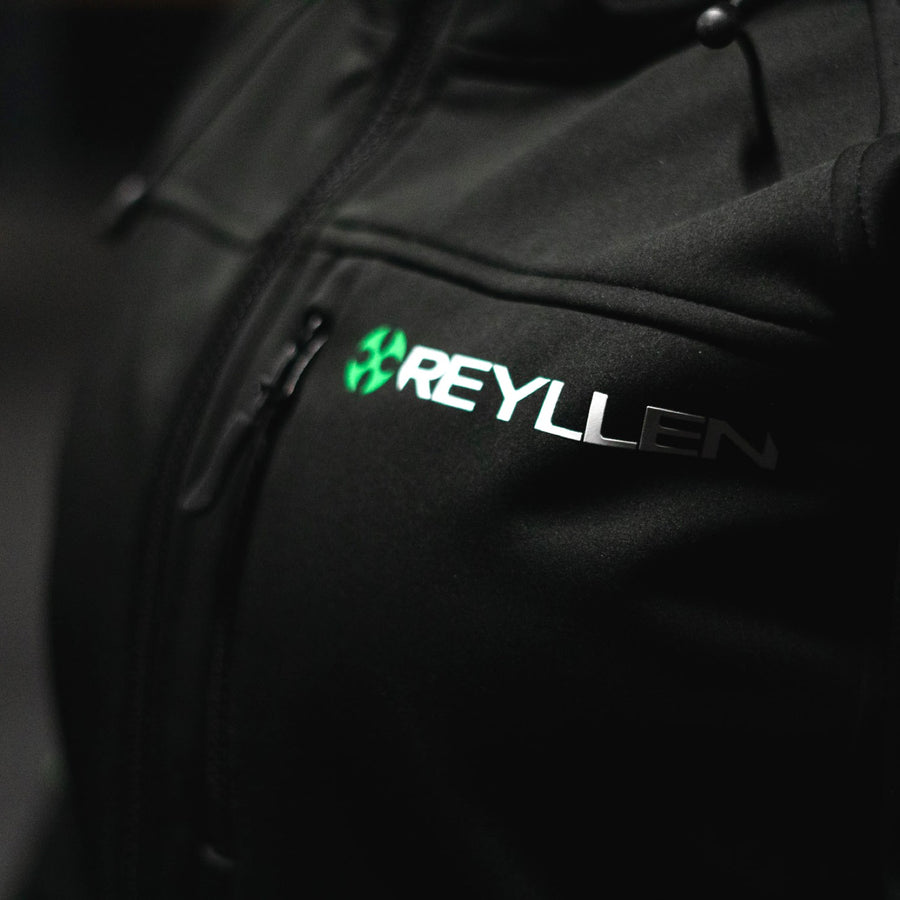 Reyllen Soft Shell Jacket Unisex Polyester Fleece Hood  worn by woman front logo detail shot